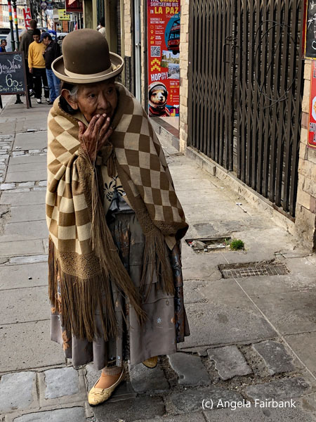 old woman walking in street