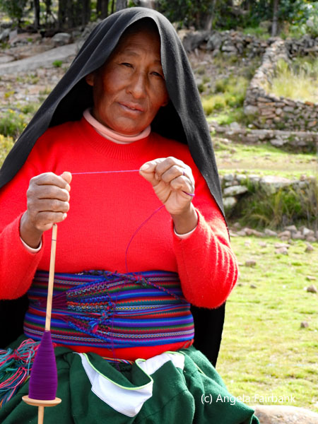 woman vendor carding wool