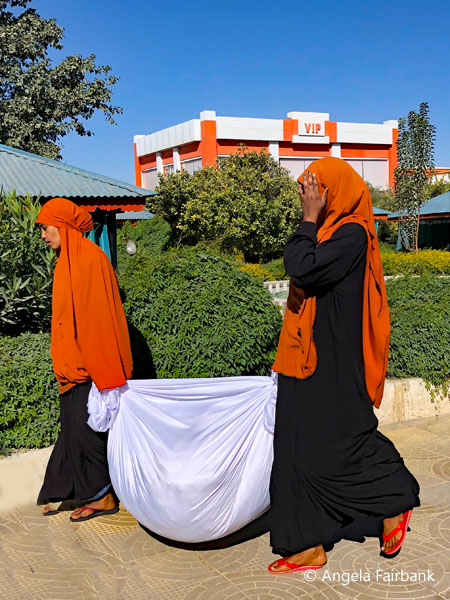 laundry  grils at hotel in black and orange