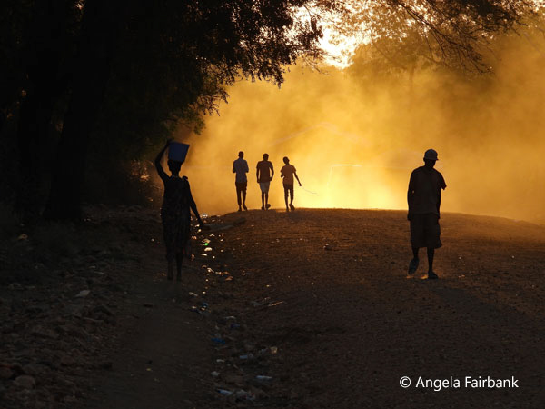 silhouettes on road in sunset 1