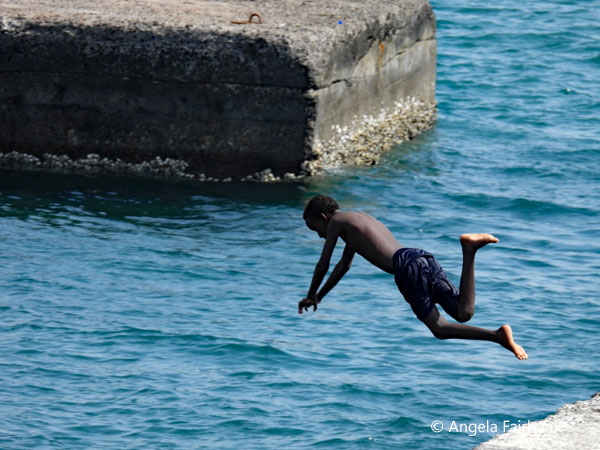 boy diving into water