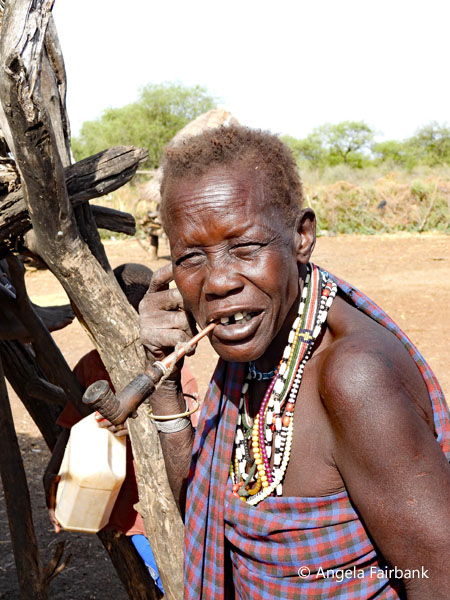 elderly Toposa woman with pipe 2