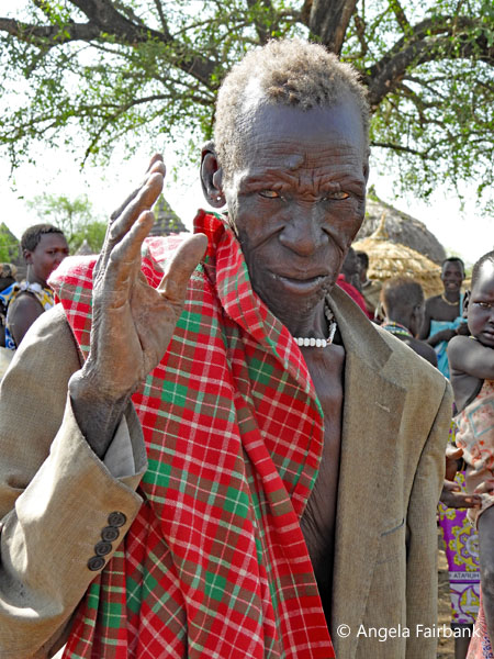 elderly Toposa man in jacket
