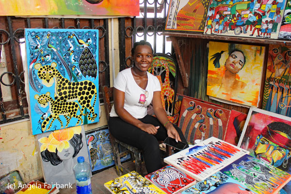 artist with paintings