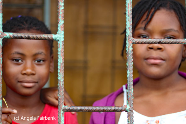 children behind grill 3