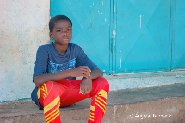 boy sitting on step