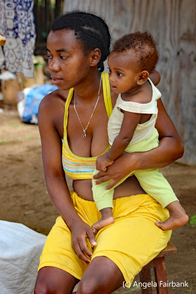woman in yellow and child