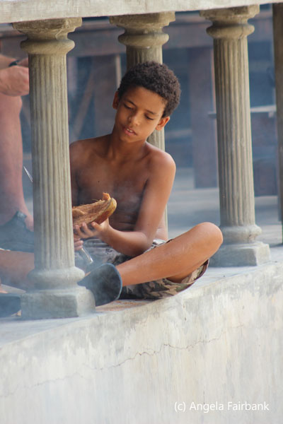 boy working on sandal