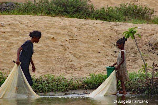 girls fishing with mosquito net