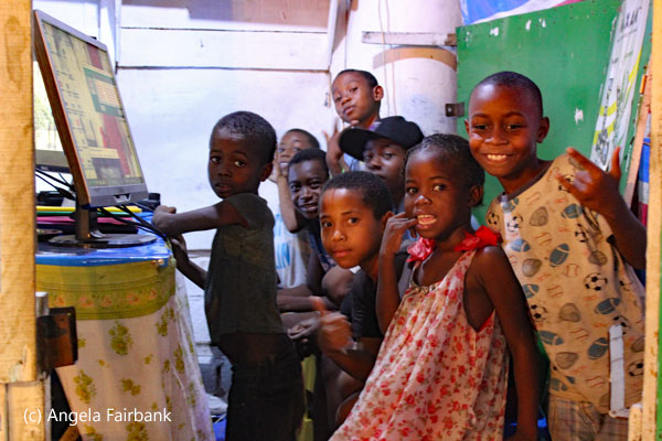 children at computer class in market