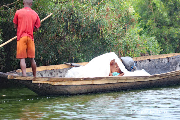 woman in canoe breastfeeding