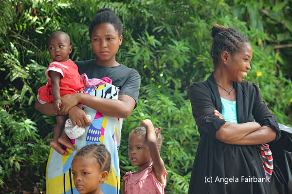 two young women with 3 children