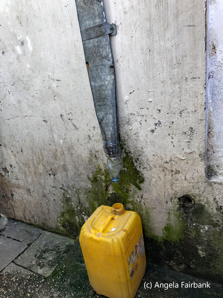 plastic canister collecting water