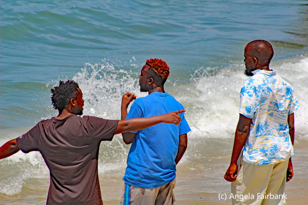 three men at beach