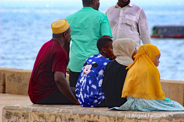 muslim family by the sea