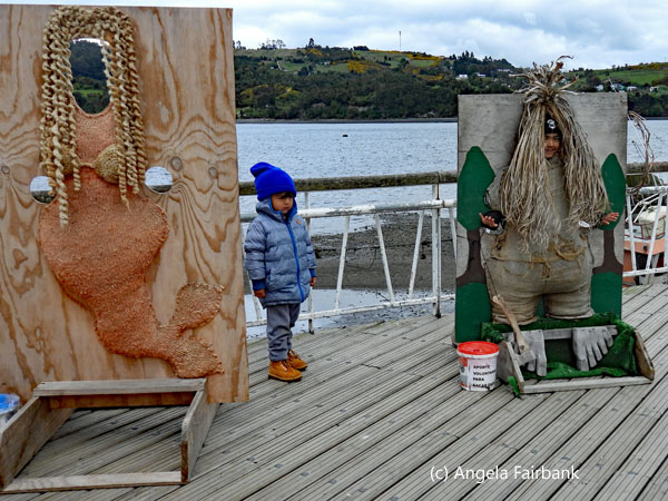 children and pier posing boards