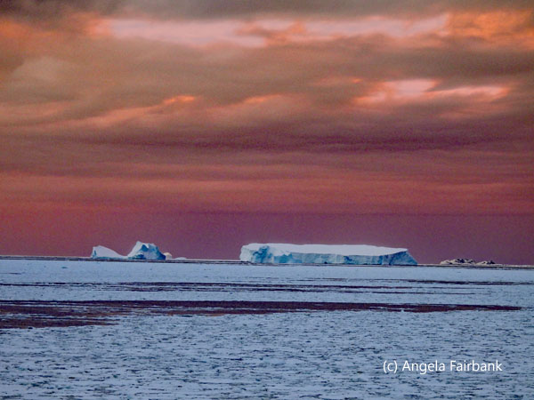orange sky with icebergs