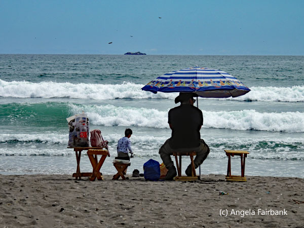 man under umbrella at la serena beach