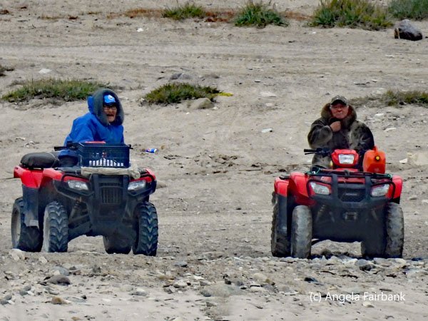 2 Inuit on ATVs
