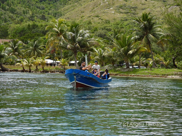 blue boat with family