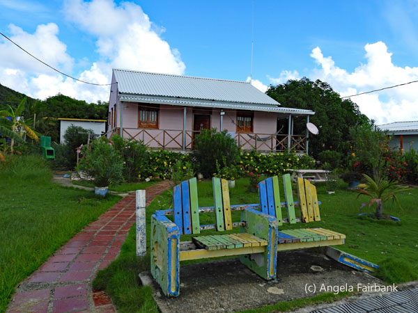 pink house with broken chairs