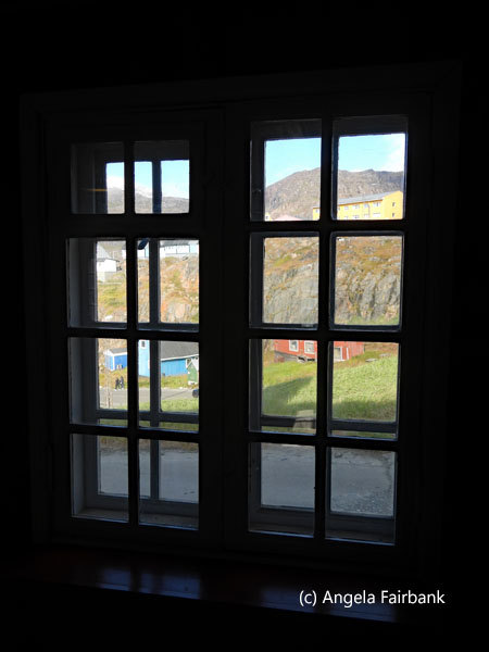 lookiing through window of old church